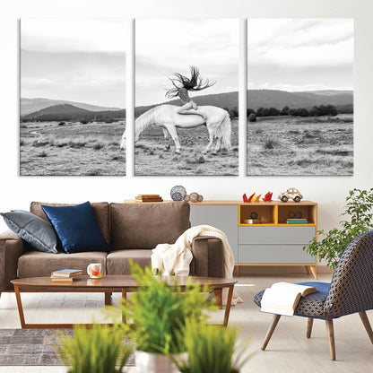 Black and white photo of a woman on a white horse in moody tones, ideal for Western Boho or modern rustic-style home decor.