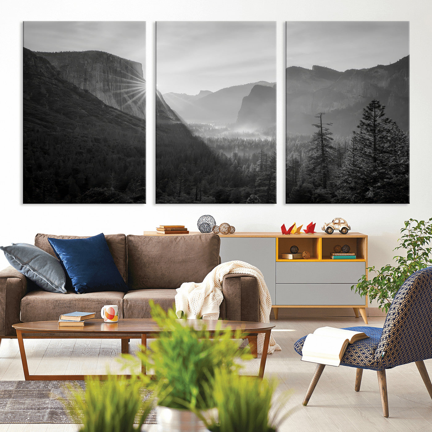 Black and white landscape of Yosemite with sun rays peeking over El Capitan, ideal for moody nature or modern rustic decor.