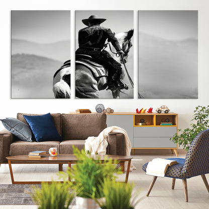 Black and white canvas of a cowboy on horseback with moody tones, perfect for rustic western or country-inspired home decor.