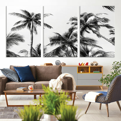 Black and white canvas of tall palm trees in moody tones, perfect for modern tropical minimalist or coastal-style home decor.