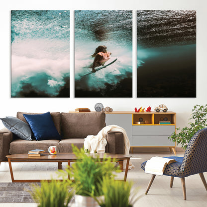 Vibrant underwater photo of a female surfer diving through turquoise waves, perfect for coastal boho or surf-inspired home decor.