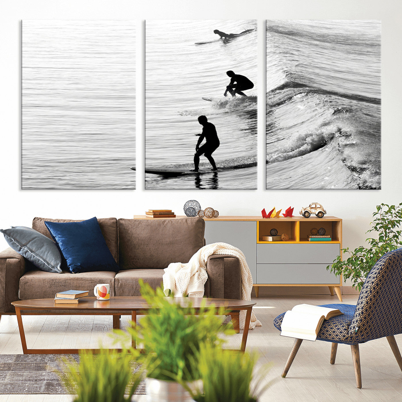 Black and white photo of surfers riding waves in a moody, high-contrast scene, ideal for modern coastal or surf-inspired home decor.