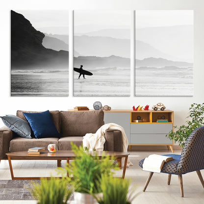 A lone surfer walking along a misty beach with cliffs in the background, carrying their board, capturing a serene and minimal ocean moment.