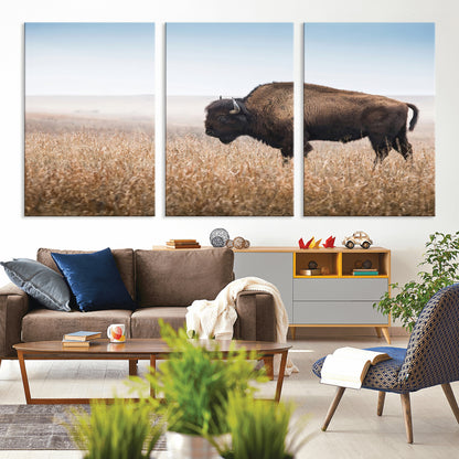 A majestic bison standing in an open prairie field, its strong form blending into the golden grass under a vast blue sky, evoking the wild spirit of the American plains.