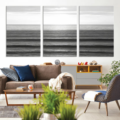 Minimalist black and white ocean view with layered waves reflecting sunlight, evoking a sense of calm and coastal serenity.