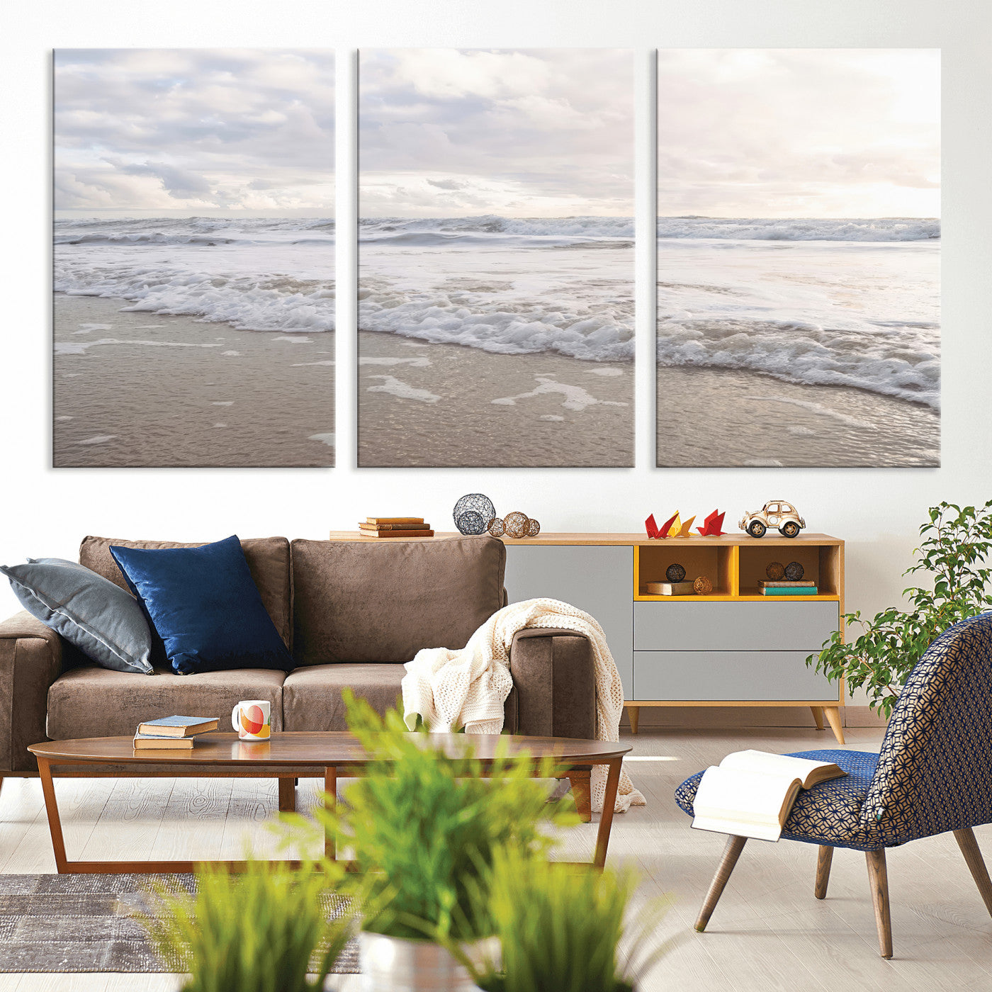 Peaceful ocean waves rolling onto the sandy shore under soft light, perfect for neutral or coastal minimalist decor themes.