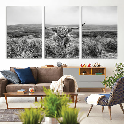 A black and white portrait of a Highland cow in a foggy Scottish countryside, capturing a rustic aesthetic and tranquil farm escape.