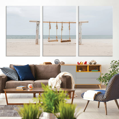 A rustic wooden beach swing stands on a serene sandy shore with an ocean horizon in the background, creating a tranquil and dreamy coastal escape.