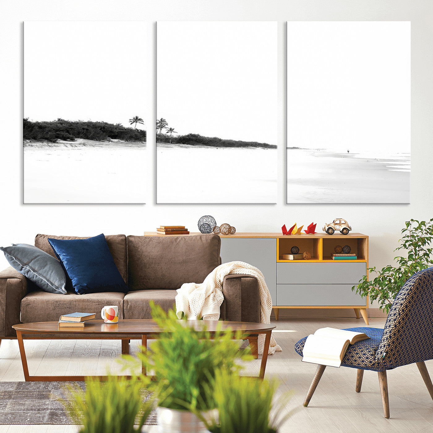 A black and white minimalist coastal scene with a vast open beach, distant palm trees, and a lone figure walking along the shoreline, evoking serenity and solitude.