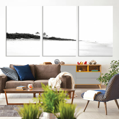 A black and white minimalist coastal scene with a vast open beach, distant palm trees, and a lone figure walking along the shoreline, evoking serenity and solitude.