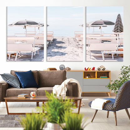A serene minimalist beach scene featuring striped umbrellas, soft pastel sand, and an elegant lounge setup, creating a tranquil and stylish coastal retreat.