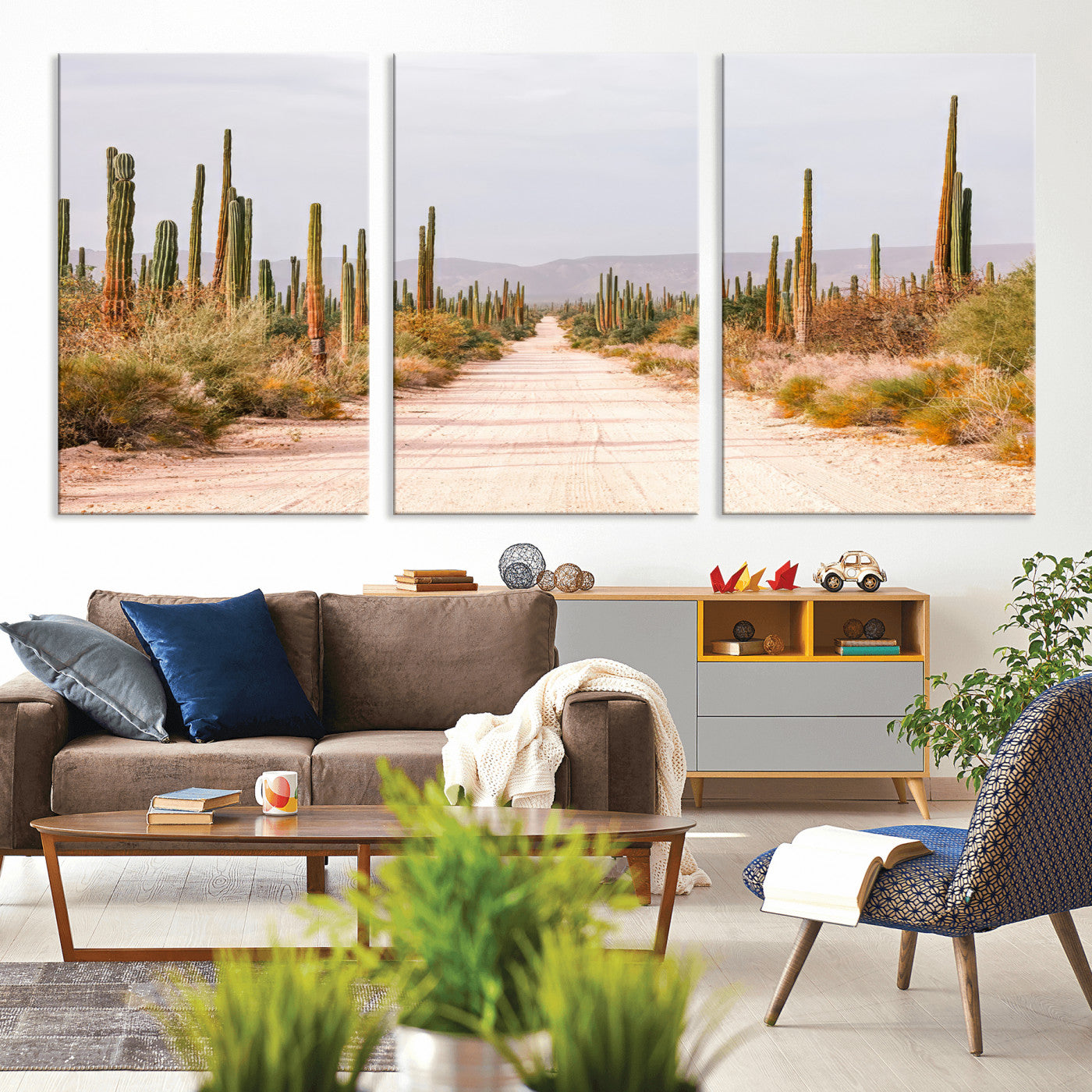 A desert road lined with saguaro cacti under a golden sky, creating a warm southwestern feel, perfect for boho or rustic decor.