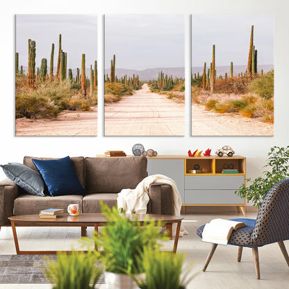 A desert road lined with saguaro cacti under a golden sky, creating a warm southwestern feel, perfect for boho or rustic decor.