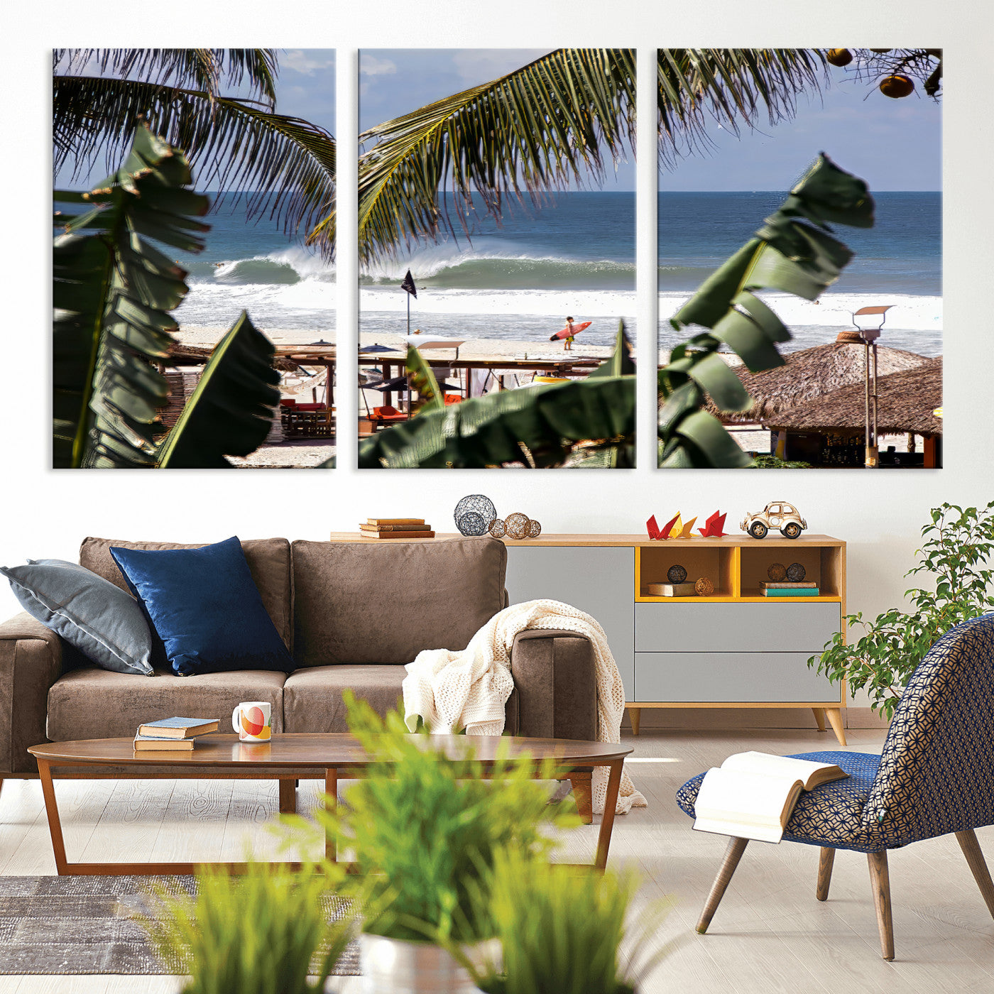 Canvas wall art of a tropical surf scene framed by palm trees, with a surfer on the shore and waves rolling in, ideal for beach-themed decor.