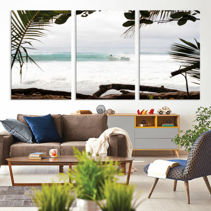 Tropical beach view with palm trees and surfer riding a wave, perfect for boho or coastal-inspired interior wall decor.