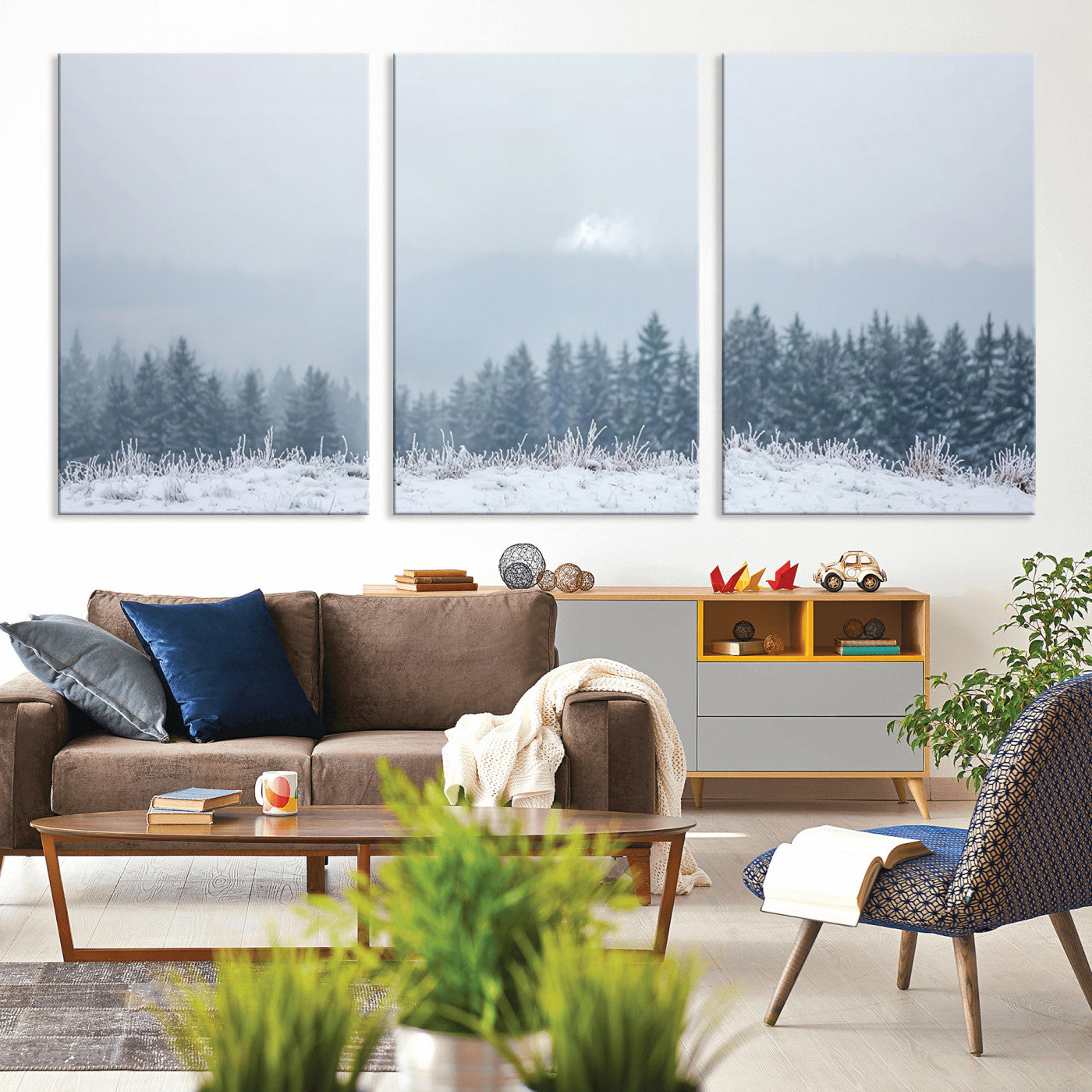 Snow-covered forest under misty sky, soft light breaking through clouds, ideal for minimalist or Nordic-inspired home decor.