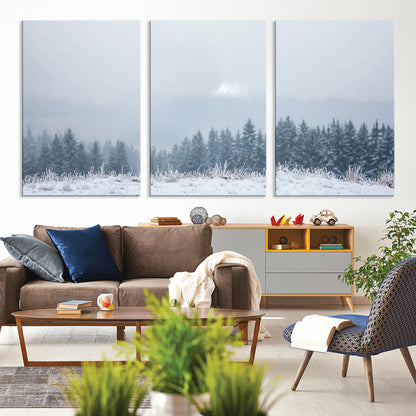 Snow-covered forest under misty sky, soft light breaking through clouds, ideal for minimalist or Nordic-inspired home decor.