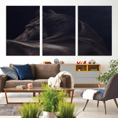 Close-up of a black horse with dramatic lighting on a dark background, perfect for rustic or masculine home decor.