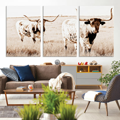 Two Texas longhorn cows standing in a sepia-toned pasture, evoking rustic charm perfect for farmhouse or western country interiors. (