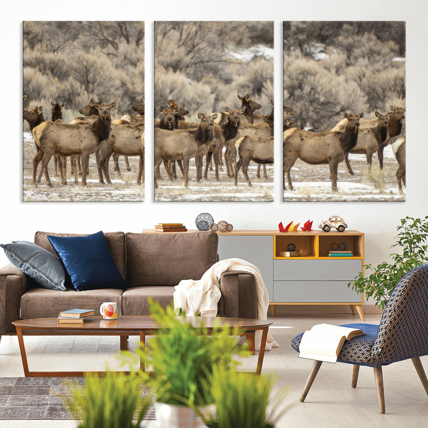 A large herd of elk standing in an open field with soft earthy tones, ideal for rustic lodge or western-themed home wall decor.