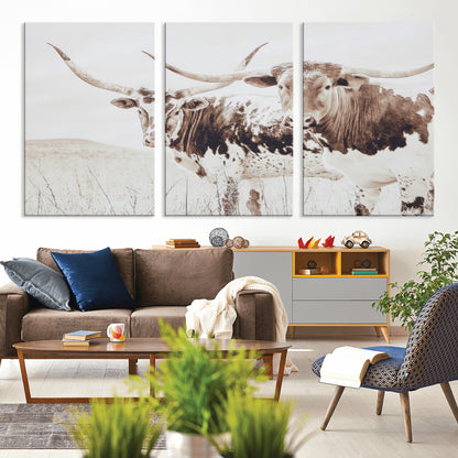 Two longhorn cows standing in a sepia-toned pasture with soft light, ideal for rustic or farmhouse-themed neutral wall decor.