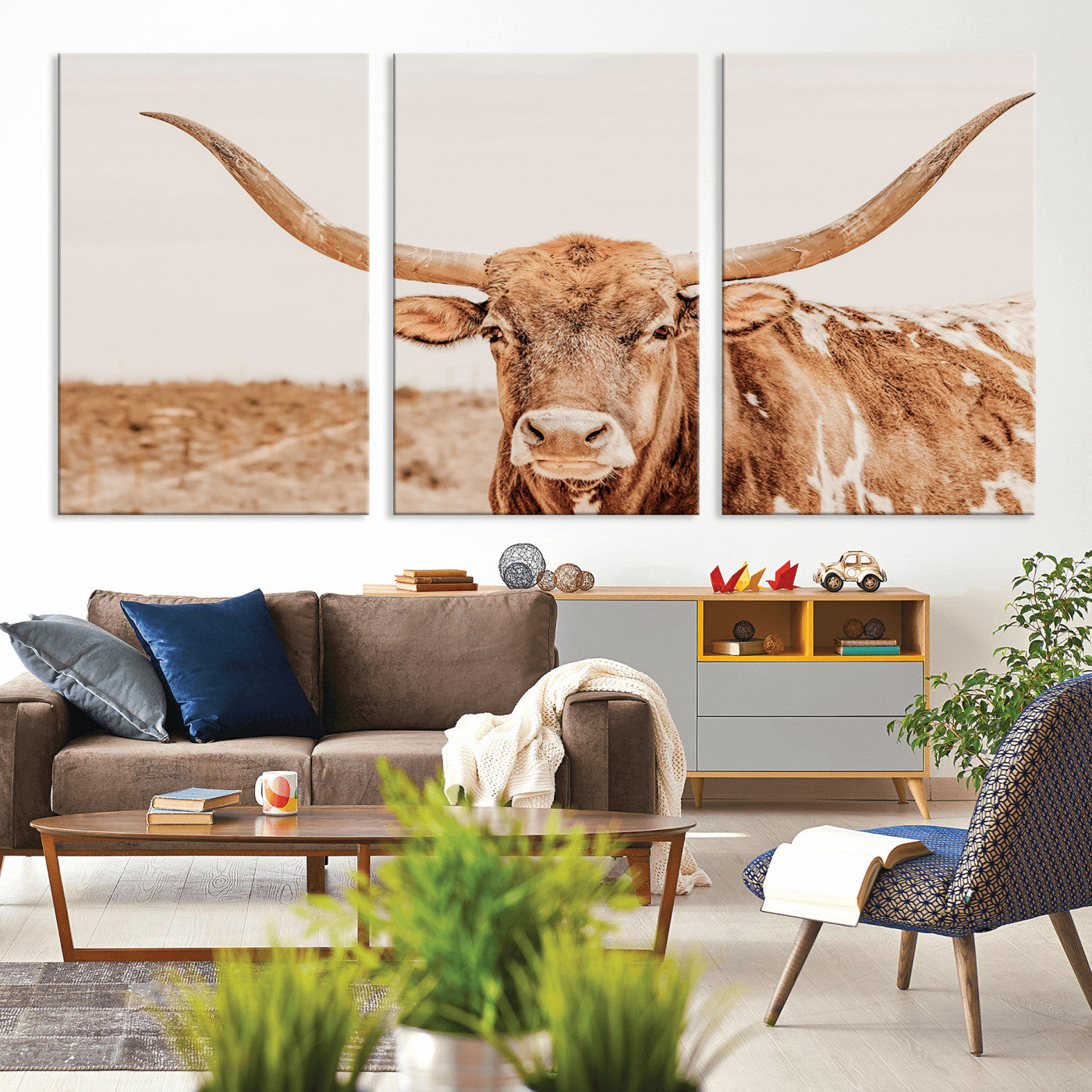 A longhorn bull standing proudly in a sunlit desert field with warm neutral tones, ideal for rustic western or farmhouse interiors.