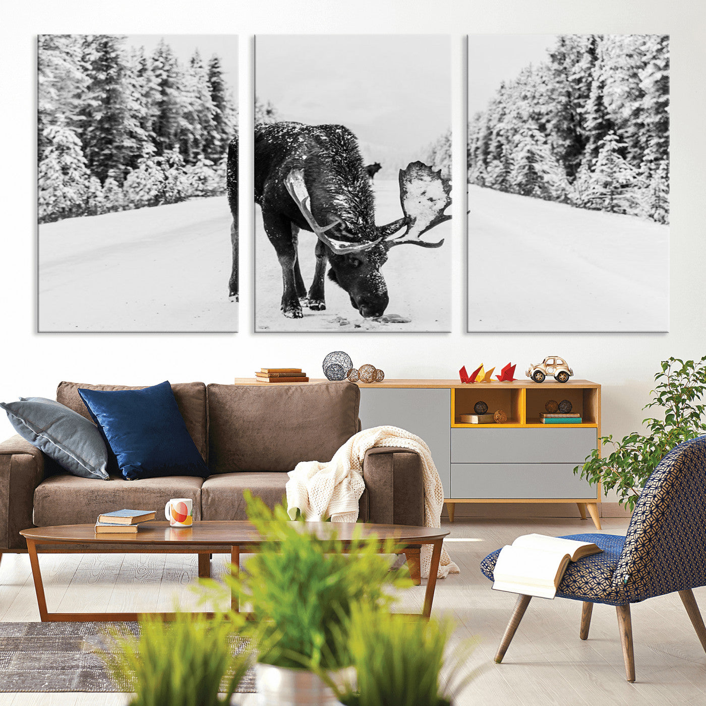 A majestic moose grazing in the snow-covered wilderness, surrounded by snow-covered trees, creating a peaceful winter scene.