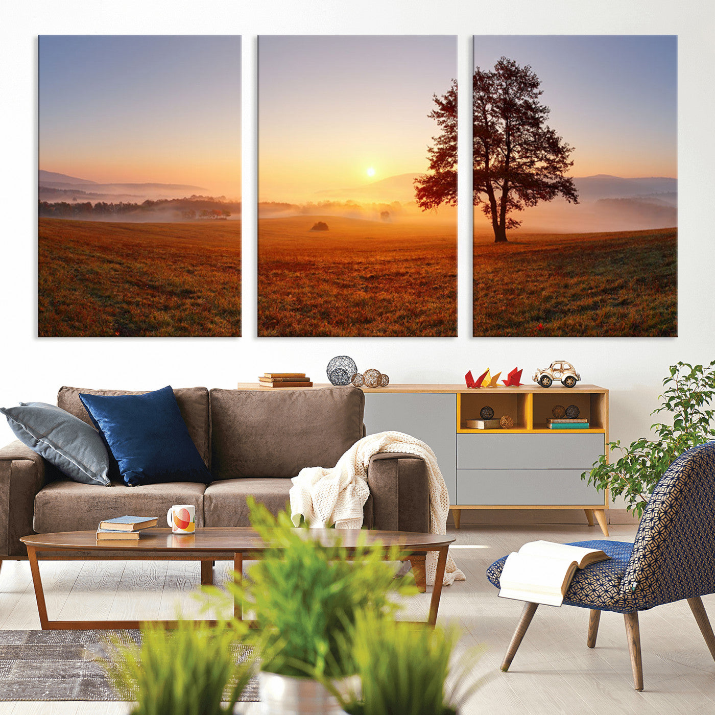 A tranquil landscape at sunrise with a mist-covered field and a lone tree, creating a peaceful and natural atmosphere.